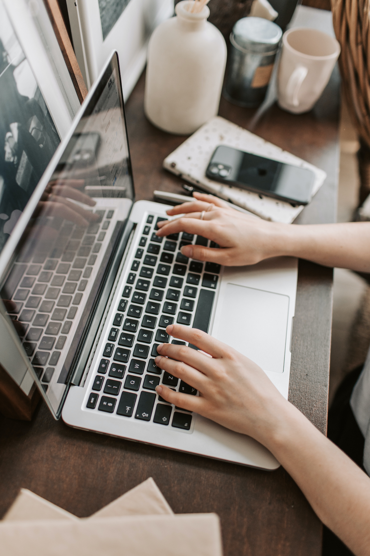 Founder setting up her AI business instructions at a laptop